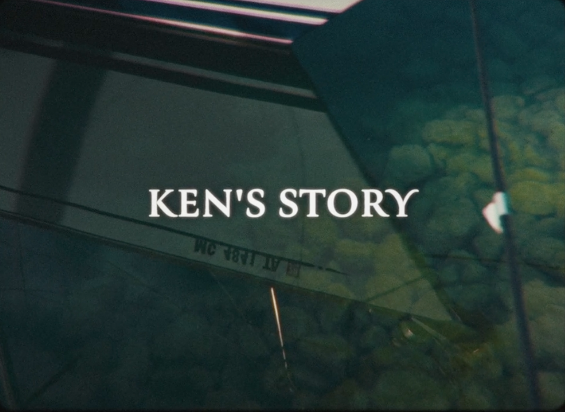 Still of Ken's Story -- Image of a sail boat reflection in the water